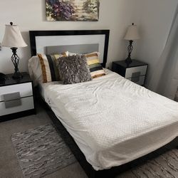Full-size bedroom set. Includes two nightstands, a mattress, a dresser, and a glass drawer. 