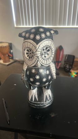 hand-carved wooden owl statue