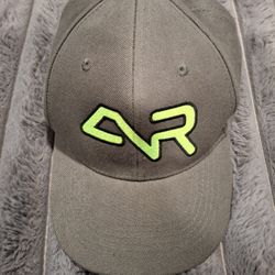 Stylish gray cap featuring a neon green logo. Perfect for casual wear.