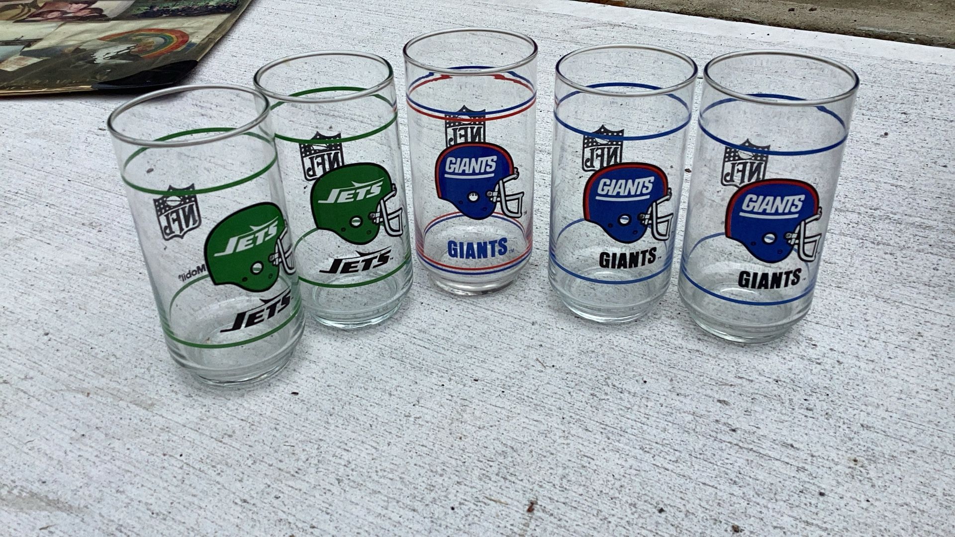 Selling a cool set of 5 collectible NFL glass cups – great for fans or display!