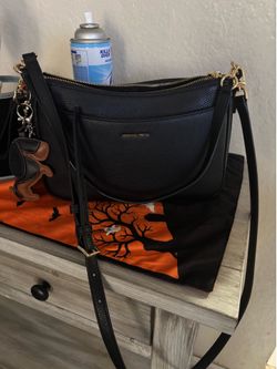 Beautiful Michael Kors, jet black purse leather?