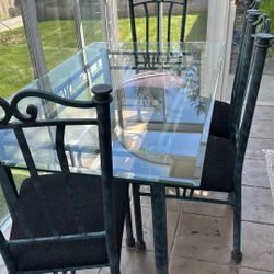 Glass table and four chairs