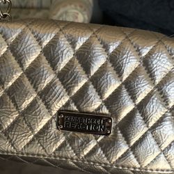 Kenneth Cole Silver Lather Purse , brand new. Original price $45
