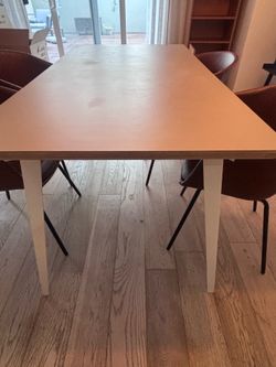 60” table with four faux leather chairs