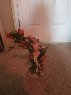 Ceramic statue fairy with pet hummingbird