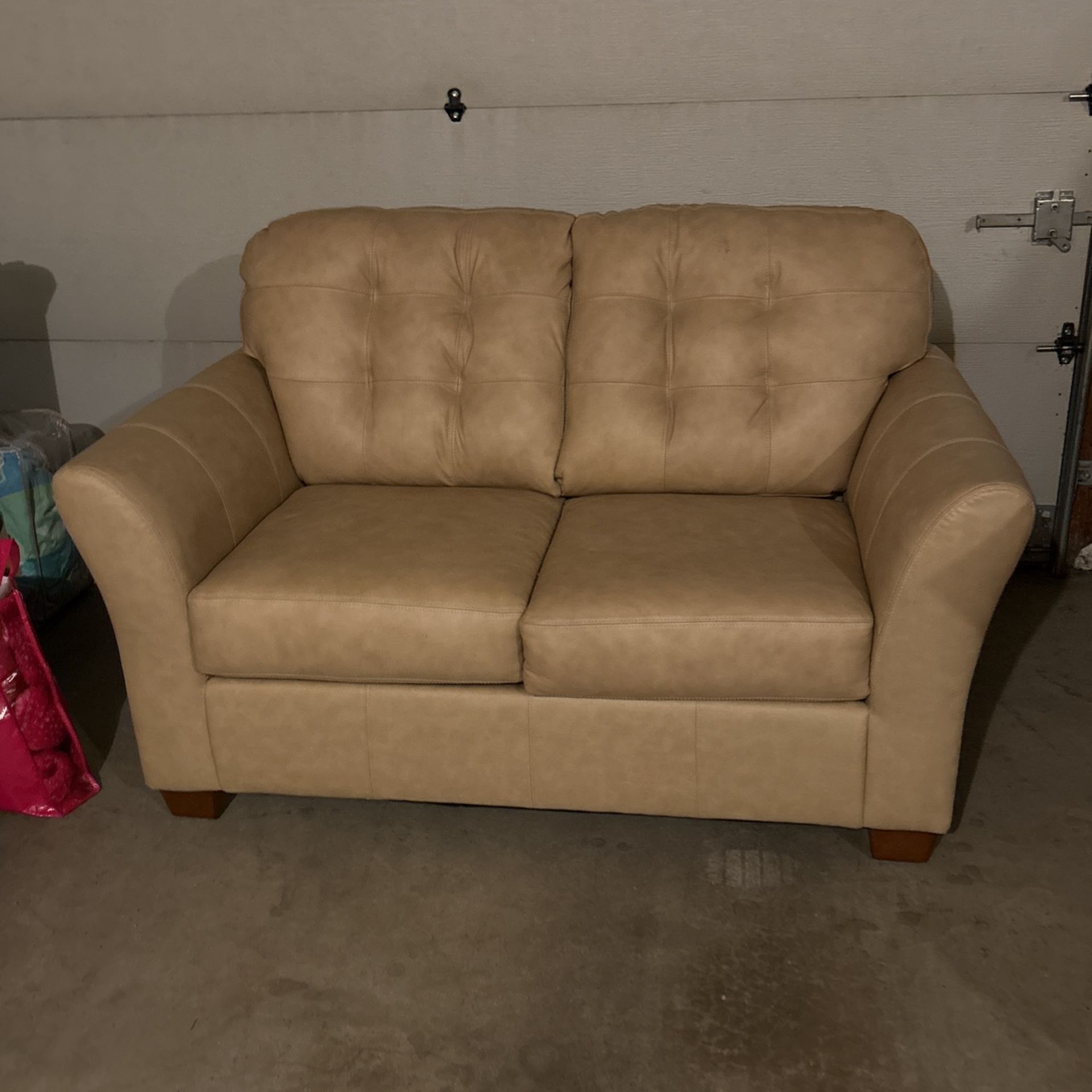 Beige Loveseat by Ashley Furniture (model MAXWHNO) for Sale in