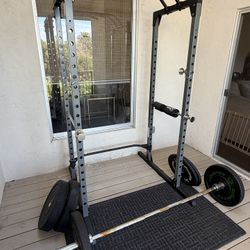 Squat Rack, Barbell, And Bumper Plates