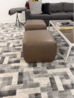 Pair of room & board leather Ottomons with wheels