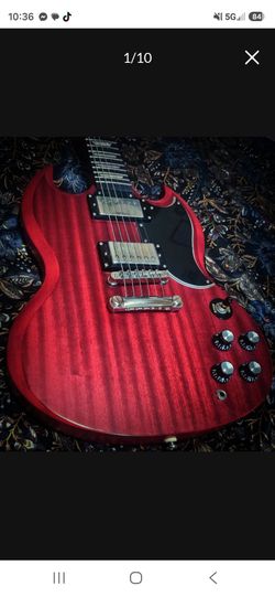 Epiphone G-400 electric guitar in a faded cherry classic Gibson SG.