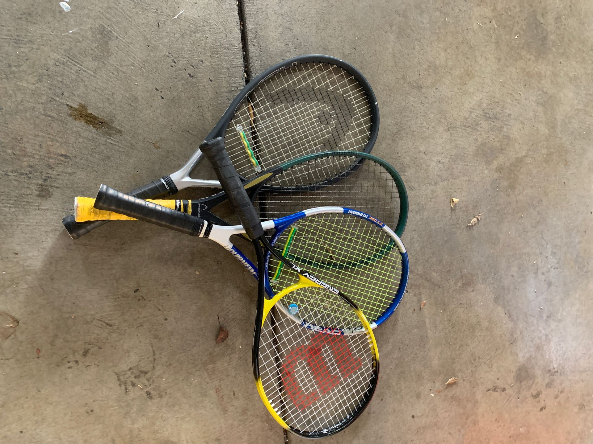 Assorted head tennis racquets and 1 Wilson kids