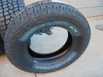 4 New 265 70 18 Bridgestone Dueler A/T Revo3 Tires Outlined White Letters 4PLY Date 2023