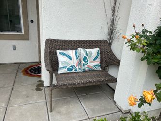 Wicker bench and pillows