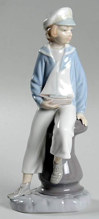 LladrĂ³ Retired Sailor Boy With Yacht Figurine
