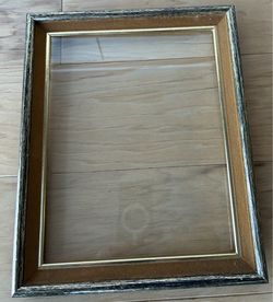 Gold frame with antiquing, glass, no mat, 9 1/2”X11 1/2” outside.