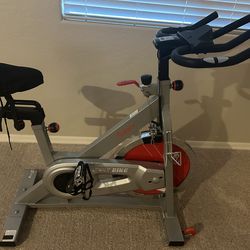 Sunny Health & Fitness Stationary Exercise Bike – Adjustable Seat & Multi-Grip Handlebar