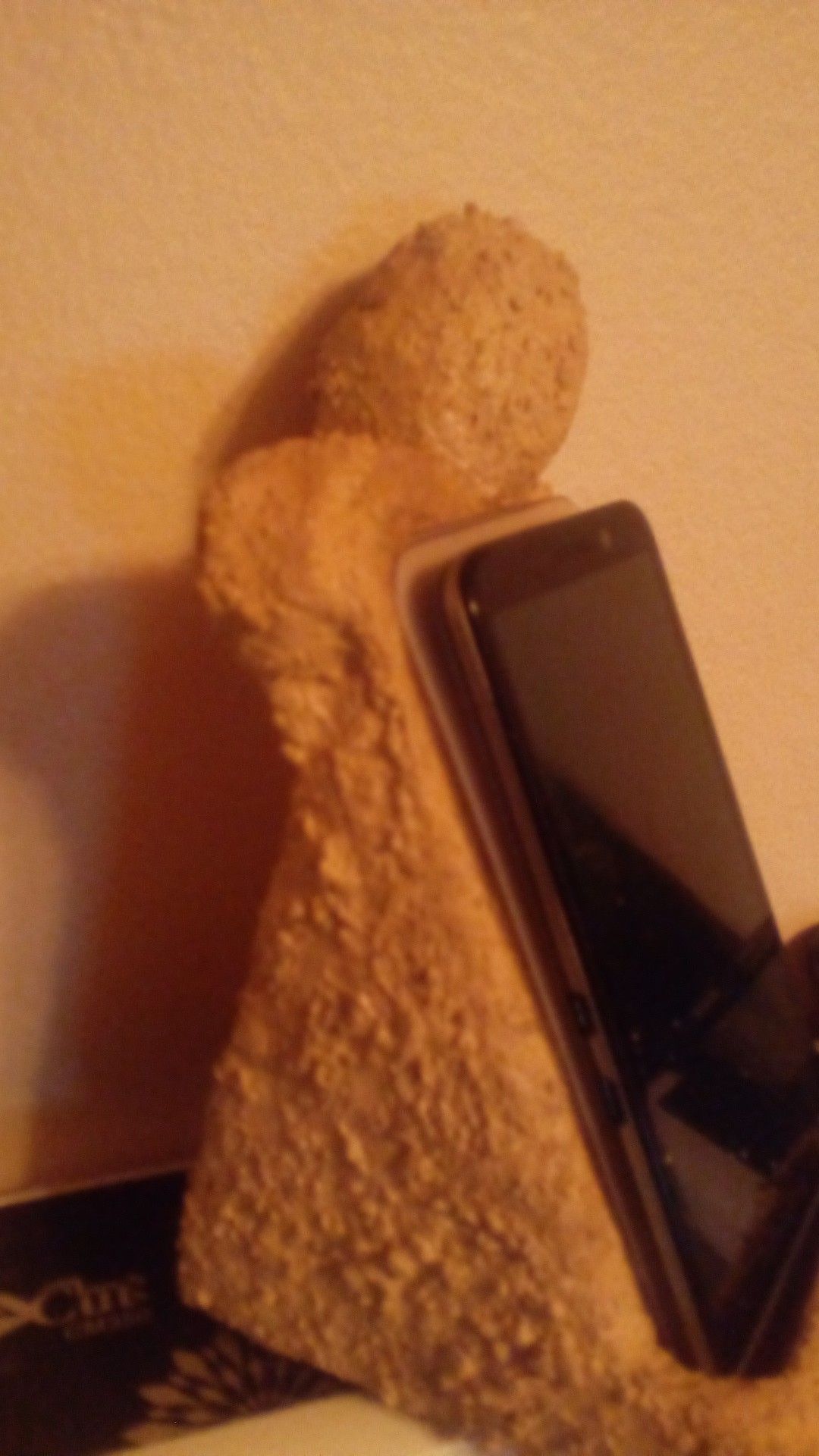 Sculptured cell phone stand