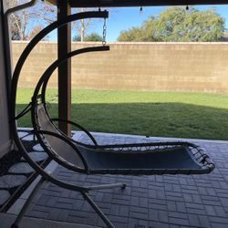 Outdoor Hanging Hammock/Chaise Lounge Chair, solid steel frame. Kept under covered patio.  