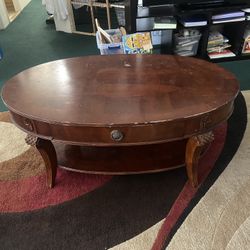 $135-Beautiful  (scratched) coffee table with storage drawer and extra storage shelf underneath  4’ X 2 1/2’ yes it is scratched from use as it is use