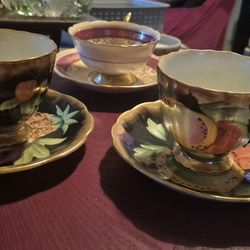 Set of hand painted teacups and saucers antique