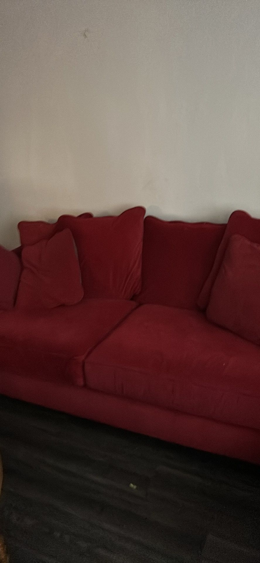 2 Red Velvety Sofas With Large Seat Cushions
