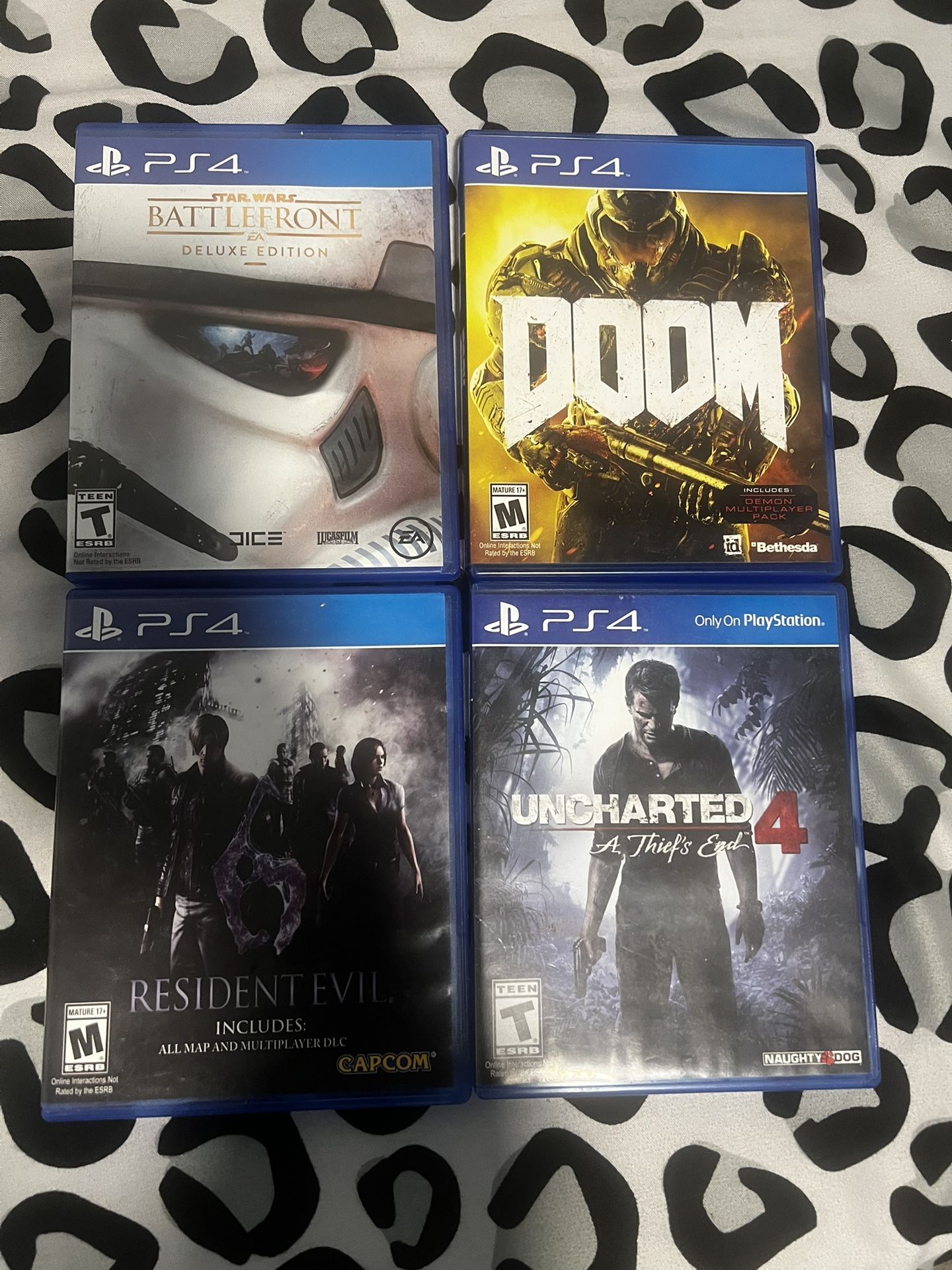 4 PS4 Game Lot Bundle: Uncharted 4, Doom, Resident Evil, Star Wars