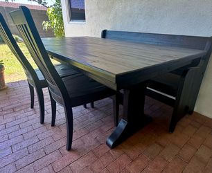 Beautiful dinning table with chairs and bench.