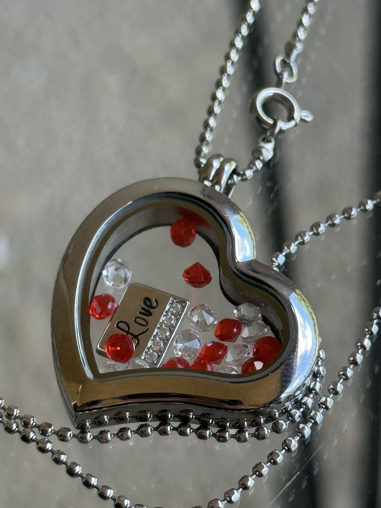Heart necklace with diamond stones inside