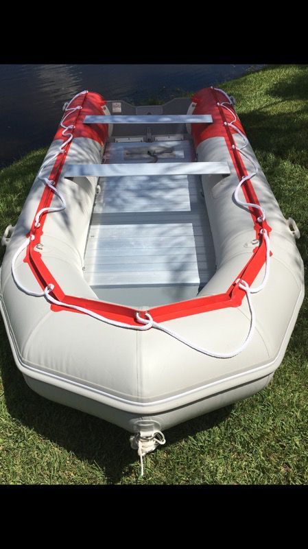 15.4 ft Inflatable boat with aluminum floor. Retails $3200.
