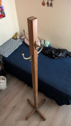 A Coat Rack with Metal Hooks