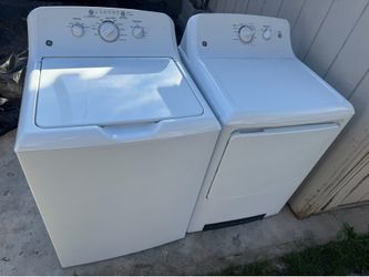 Lavadora y secadora funcionando
