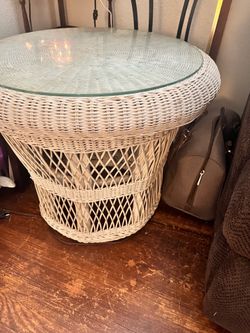 Wicker table with glass