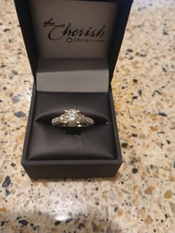 14kt white gold natural diamond ring.