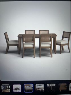 Natural wood dining table with six chairs