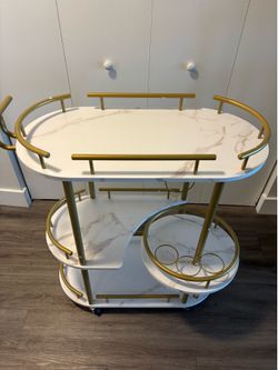 Beautiful Marble, gold, and white bar cart