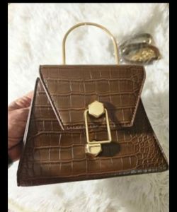 Small brown leather bag with gold long chain