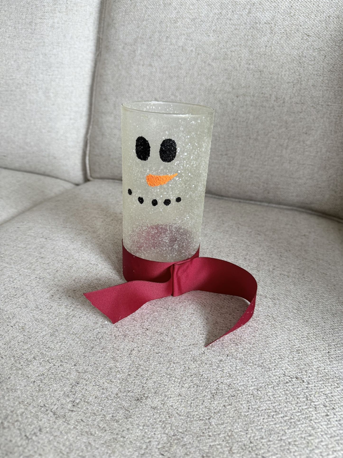 Beautiful snowman-themed glass jar, also referred to as a "Glass Jar Candle Snowman". Popular for holiday or winter decor and can be used with candles