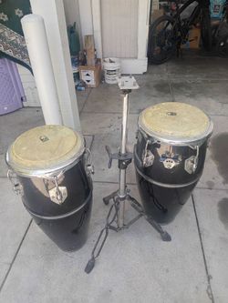 A pair of Toca player series congas with stand