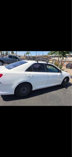 White Sedan with Roof Rack