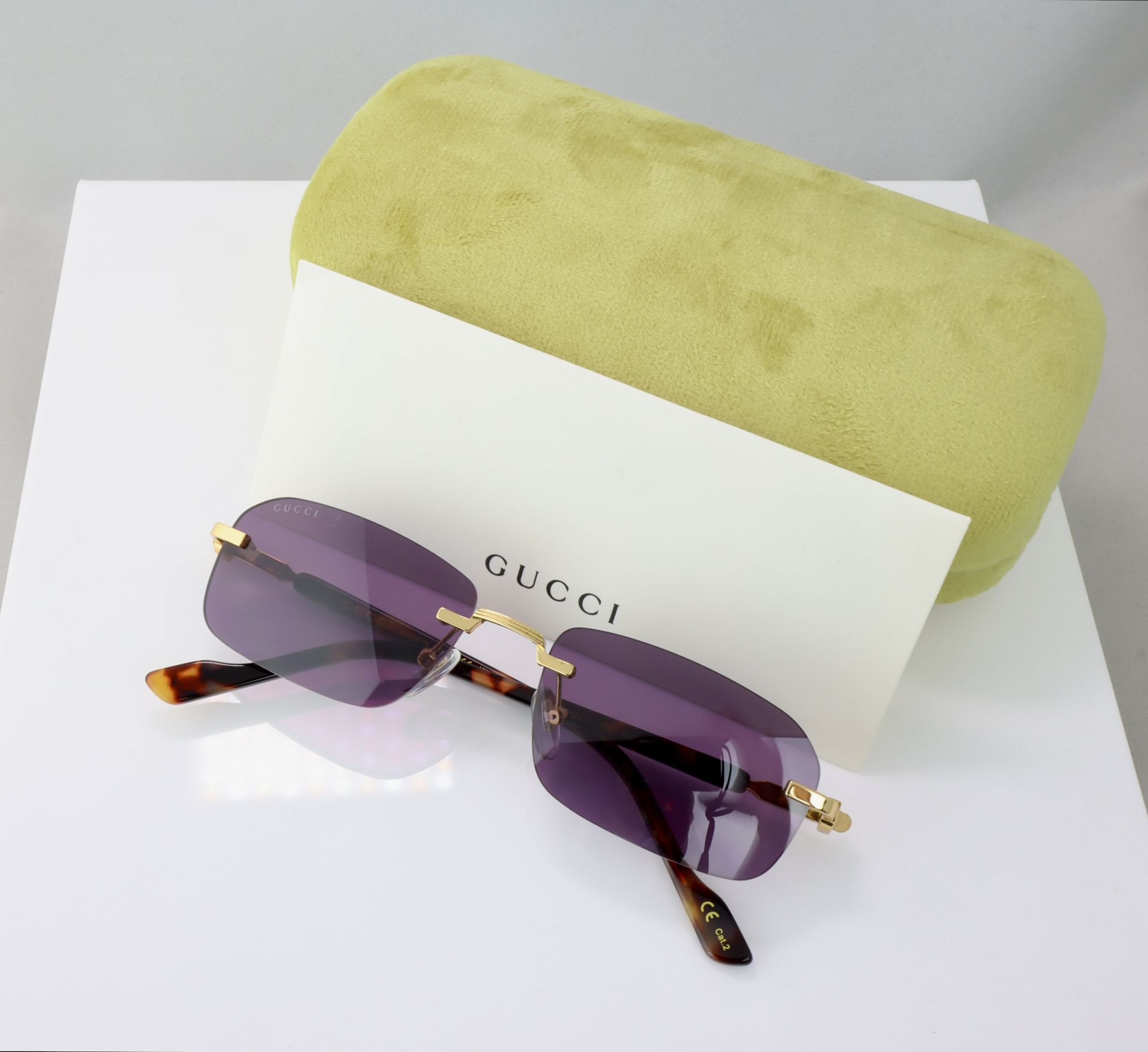 Gucci Rectangle Sunglasses in Gold With Purple Lens