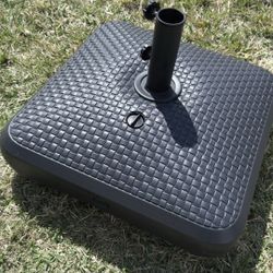 Large umbrella base with wheels for sale.