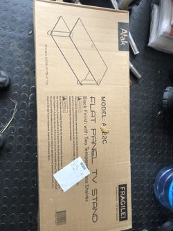 Brand new in the box TV stand with Glass shelves