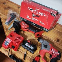 Milwaukee M18 'Fuel' angle grinder, M12 'Fuel' 5/8" SDS Plus rotary hammer/drill, batteries, charger