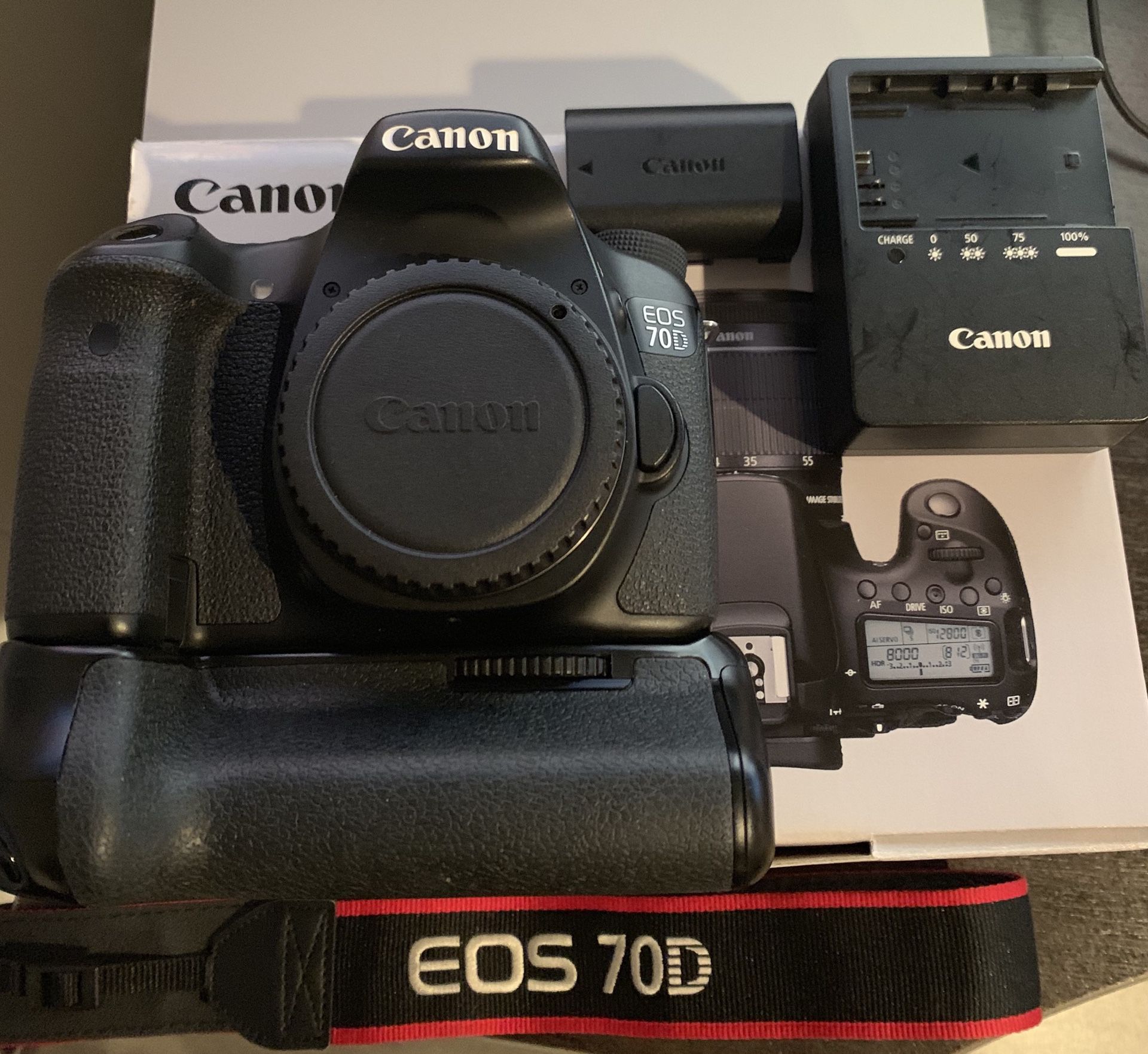 Canon 70D body with battery grip and 18-55mm lens.