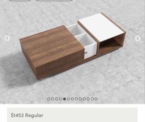 The Truman Coffee Table is a contemporary piece unlike any other. Its sophisticated, functional form includes sliding hidden storage while a clean tab