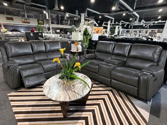 Gray faux leather reclining sofa with USB ports & cup holders