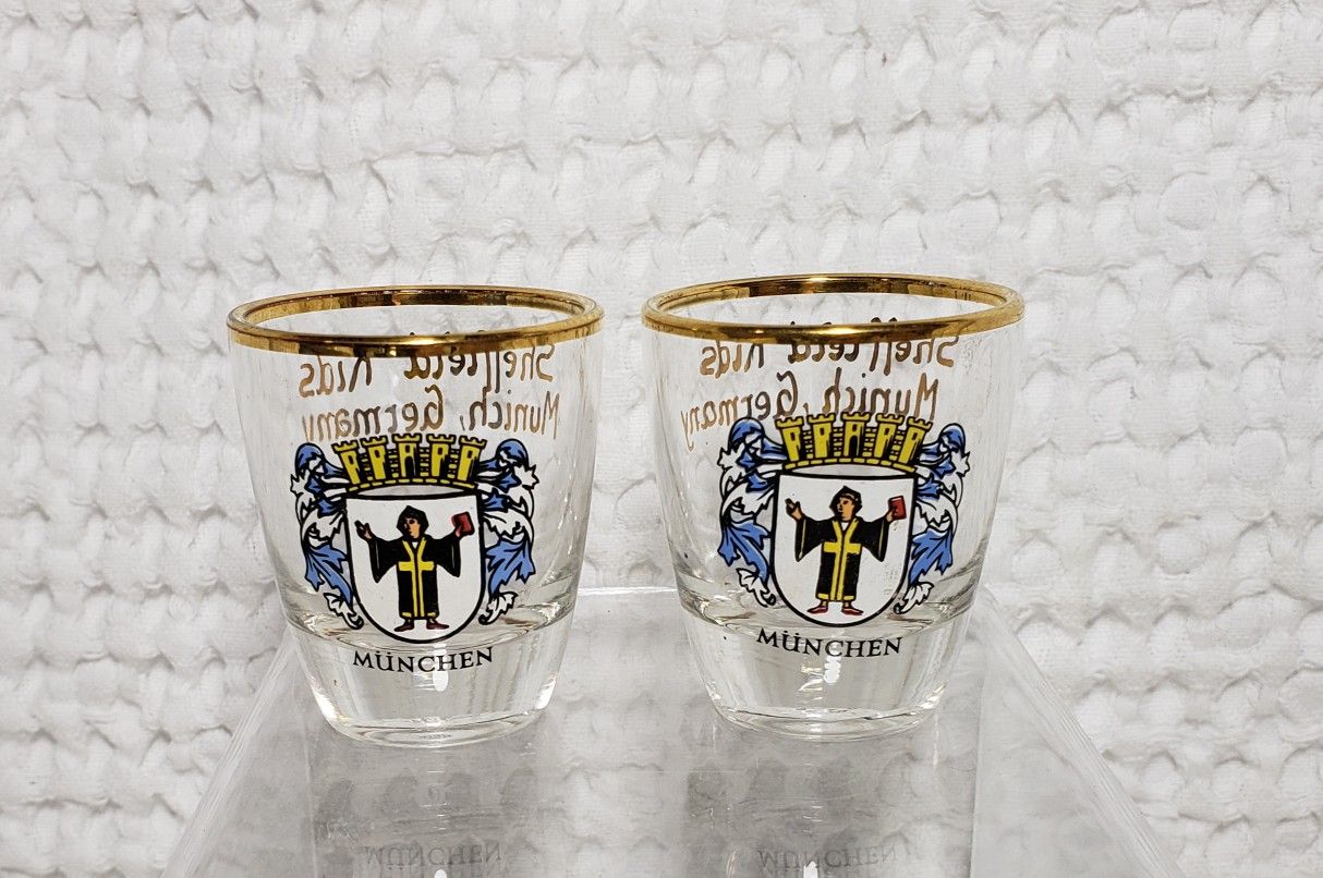 Sheffield kids Munich Germany glass shot glasses . Set of 2 that measures 2" H X 2 1/2" W . Good condition and smoke free home. 