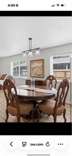 Elegant Round dark wood dining table with 4 chairs and leaf