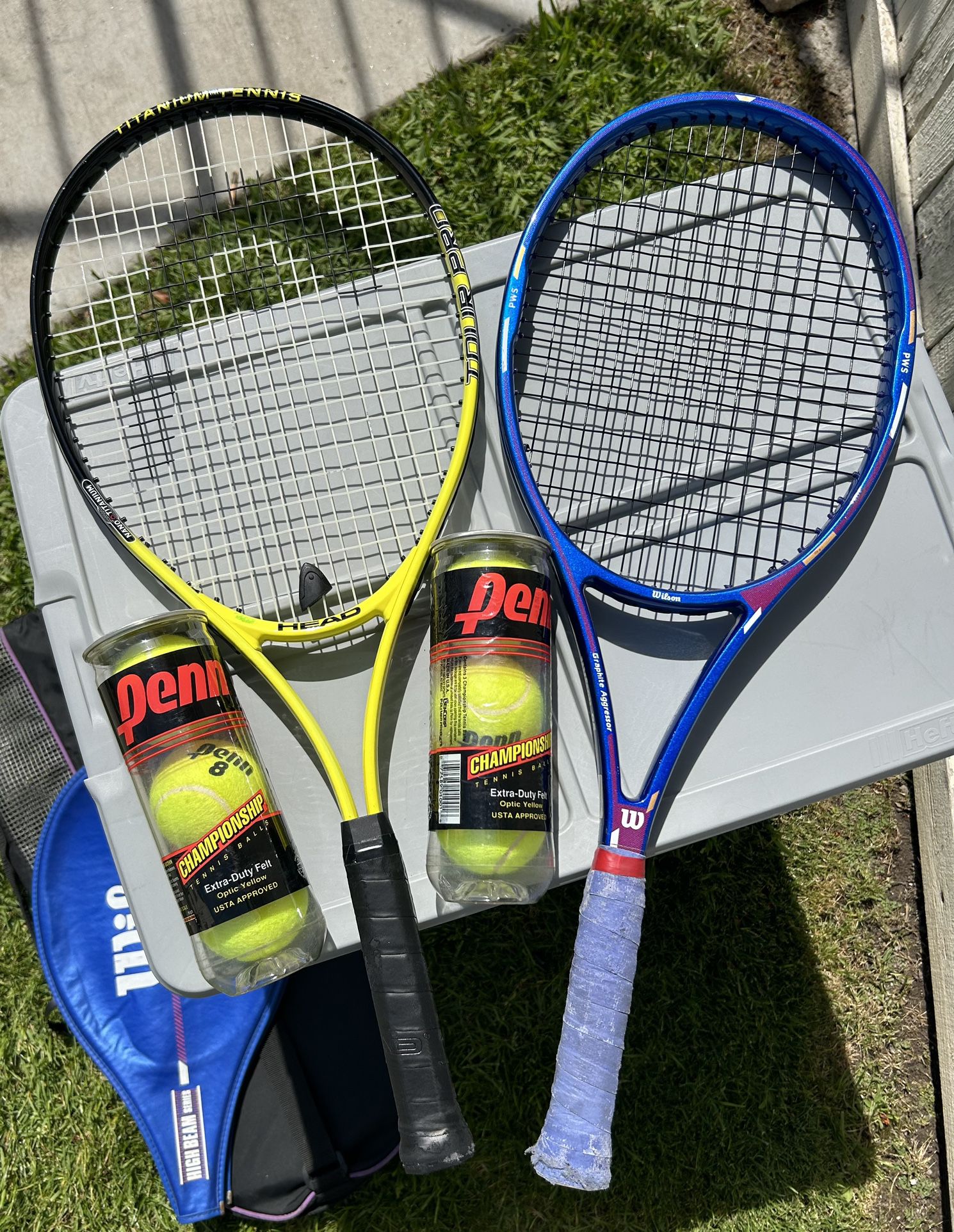 Two Tennis Rackets And Tennis Balls