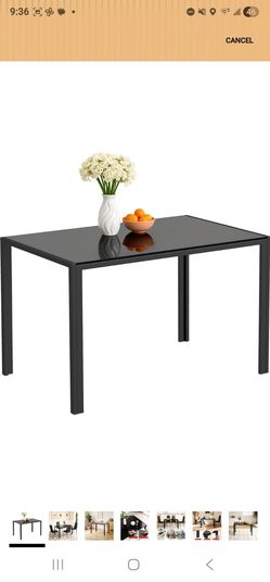 Black glass dining table with 4 chairs