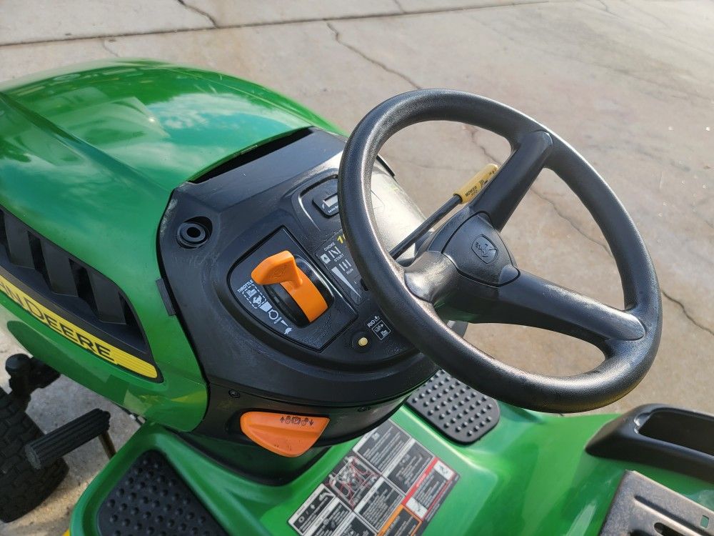 John Deere D110 riding lawn mower, 19hp engine, 42" deck and auto